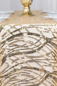 The Champagne Sequins Table Runner is more than just a decorative piece; it is a statement of style and sophistication. Its versatility allows it to be used for various events, from weddings to parties and everything in between. Add a touch of glamour to your table decor and impress your guests with this stunning table runner. Embroidered Table Runner, Sequin Decor, Color Champagne, Wedding Ceremonies