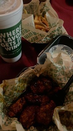 some food and a drink are sitting on the table next to each other, ready to be eaten