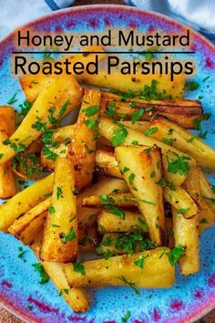 honey and mustard roasted parsnips on a blue plate with text overlay