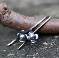 Tiny sterling silver flower dangle earrings An organic heat formed bud encircled by 5mm sterling petals sits proudly at the end of these perfect size adornments. These dangles measure ¾ inch long ♥ The pictures are taken using the macro setting to capture detail. These are petite earrings (see 2nd picture for size reference) Petite Earrings, Flower Dangle Earrings, Minimalist Flowers, Jewelry Sale, Silver Dangle Earrings, Sterling Silver Flowers, Tiny Flowers, Everyday Earrings, Christmas Jewelry