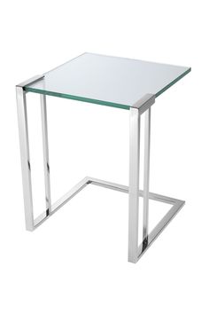 a glass table with metal legs on a white background