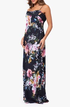 A vibrant, oversized floral print pops against a black background on this charming gown topped with a drapey cowl neckline that only adds to the romance. 60 1/2" length Hidden back-zip closure Cowl neck Spaghetti straps Lined 100% polyester Dry clean Imported Spring Evening Maxi Dress With Cowl Neck, Cowl Neck Maxi Dress For Spring Evenings, Multicolor Floral Print Maxi Dress For Evening, Black Floral Print Maxi Dress, Black Floral Print Maxi Dress For Evening, Black Floral Maxi Dress For Garden Party, Black Floral Print Floor-length Maxi Dress, Vibrant V-neck Maxi Dress With Floral Print, Elegant V-neck Maxi Dress With Abstract Print