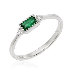 This dainty band features a beautiful, natural baguette cut emerald center, bookended with diamonds and set in 14k gold. A simple, striking ring. Custom sizes from 2-12 available to order, as well as other colored stones - contact us to find out more. Classic Green Diamond Ring With Baguette Diamonds, Elegant Emerald Ring With Baguette Diamonds In White Gold, Classic Emerald Ring With Baguette Diamonds, May Birthstone Baguette Cut Diamond Rings, Classic Emerald Ring With Baguette Diamonds For Promise, Gold And Emerald, Baguette Band, Dainty Band, Jewelry Wardrobe