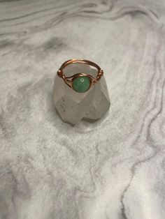 Handcrafted Copper Gemstone Rings May Birthstone Jewelry With Stone Setting, Adjustable Round Emerald Birthstone Ring, Adjustable Round Emerald Ring As Birthstone, Adjustable Round Emerald Ring With Birthstone, Handmade Green Jewelry With Round Stone, Wire Wrapped Round Ring For Promise, Adjustable Rings With Natural Stones, Adjustable Gemstone Rings With Round Stones, Handmade Adjustable Rings With Round Stone