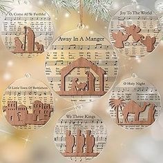 christmas ornament set with nativity scene and music sheet on tree branch in front of blurry background