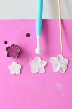 the crafting supplies are ready to be used for making paper flowers and butterfly shapes