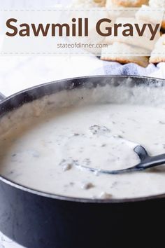 a pan filled with soup next to crackers and bread on the side, text reads savmll gravy