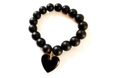 Cool and casual statement bracelet. Large 12mm matte black onyx beads with double sided black enamel heart charm. The bracelet you will want to wear with everything. Custom sizes available upon request. Onyx Bead, Statement Bracelet, Black Heart, Heart Charm Bracelet, Black Enamel, Gold Plated Jewelry, Jewelry Plate, Bracelet Sizes, Ring Bracelet