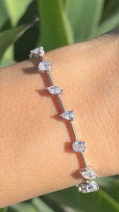 Diamond Tennis Bracelet Multi Shape Prong Set Ovals, Pears, Marquise Alternating *All specifications are for 7 Inches Specifications: -Model #: KINETICART-BR-ABJI-26854-1 -Metal Type Available: 18K, 14K White Gold, Rose Gold, Yellow Gold -Width of Bracelet: Gold Bar: 0.8 MM Including Prongs: 4.8 MM -Height of Bracelet: 3.2 MM -Gold Weight: 7 Grams -Total Diamond Weight: 6 Ovals 1.12CT 6 Marquise 0.93CT 6 Pears 0.70CT = 2.75CT -Color: F-G -Clarity: SI *18K GOLD & PLATINUM ALSO AVAILABLE WITH Luxury Elegant Oval Diamond Bracelet, Luxury Oval Bracelets For Engagement, Luxury Modern Oval Diamond Bracelet, Luxury Oval Diamond Bracelet With Jubilee Band, Luxury Oval Bracelet, Luxury Oval Diamond Bracelet, Luxury Oval Diamond Bracelet For Women, Luxury Oval Tennis Bracelet With Prong Setting, Luxury Fusion Style Oval Jewelry