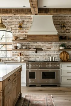 a kitchen with an oven, stove and counter top in the middle of the room