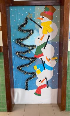 a door decorated with snowmen and christmas trees