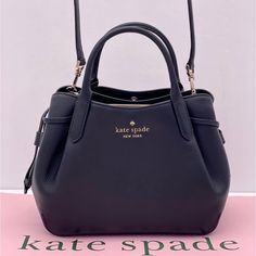 Brand New With Tag Kate Spade Dumpling Small Satchel Product Details Color: Black Measurements 9.4" W 7.9" H 5.2" D Handle Drop: 4.25" Features Strap Drop: 22" Metal Pinmount Logo Closure Type: Magnetic Snap Closure With Middle Zip Compartment Dust Bag Included: No Interior: Back Zip Pocket Exterior: Front And Back Slip Pockets Materials Pebbled Leather Lining: Two Way Spade Jacquard Lining Imported Style Number K8135 Kate Spade Crossbody Satchel For Evening, Kate Spade Black Satchel For Evening, Kate Spade Satchel With Removable Pouch For Evening, Kate Spade Evening Satchel With Removable Pouch, Kate Spade Black Shoulder Bag With Top Carry Handle, Kate Spade Black Crossbody Satchel, Kate Spade Black Satchel With Adjustable Strap, Kate Spade Satchel, Black Leather Satchel