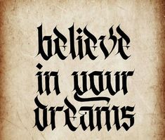 the words believe in your dreams written on an old parchment paper with black ink,