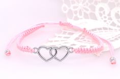 Handmade bracelet with HEART in metal. It is infinitely adjustable in length and can be applied up to a circumference of 22 cm. Metal Bracelets With Sliding Knot, Nickel-free Pink Bracelets For Friendship, Trendy Pink Braided Bracelet For Friendship, Adjustable Pink Friendship Bracelets, Nickel-free Silver Friendship Bracelet, Handmade Adjustable Metal Braided Bracelets, Pink Braided Bracelet With Adjustable Cord As Gift, Adjustable Metal Braided Bracelets, Trendy Silver Braided Bracelets For Friendship