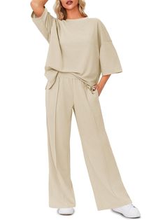 PRICES MAY VARY. Stay effortlessly chic in this oversized outfit that includes a 3/4 sleeve side slit t-shirt and high-waist pants. The combination of comfort and style makes it ideal for various casual occasions. The t-shirt features stylish side slits that not only add a touch of flair but also allow for easy movement and a breezy feel. The side slits on the t-shirt add a trendy touch to the classic design, allowing for ease of movement and a touch of flair. The high-waisted pants are designed Comfy Oversized Outfits, Spa Day Outfit, Womens 2 Piece Outfits, Clothing Aesthetics, Church Fashion, Oversized Outfit, Home Wear, Fashion 2024, Tracksuit Set