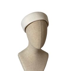 This styish pillbox hat would make a great bridal headpiece if you order it in white.  But we can make it in more than a dozen colors to be worn at during the day or at a formal or semi formal event.  The high quality wool felt was hand shaped on a vintage wood block into a light and comfortable retro hat.  It does not cover the ears, it sits higher up on the head.   Its slightly asymmetrical shape which gives it a special twist and it sits on the head perfectly. fits head size very large 60-63 White Pillbox Hat, Winter Beret, Retro Hat, Retro Hats, Pillbox Hat, Dress Hat, Large Dress, White Hat, Bridal Headpiece