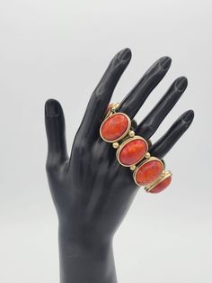 "Vintage Gold Tone & Faux Red Coral Cabochon Beaded Stretch Bracelet Costume This chunky bracelet has a great bohemian look.  The bracelet is made up of brushed gold-tone oval settings & beads that are strung on 2 elastic bands.  The bands have almost no stretch.  Inside the settings are large faux red coral cabochons.  This bracelet is in excellent, nearly new condition.   Dimensions: 7\" long, 1 1/8\" wide Clasp: Stretch Markings: None Condition: Excellent - nearly new All of my shop items are pre-owned vintage.  All pieces should be expected to have some vintage wear unless otherwise stated.   Great for the vintage & costume jewelry lover!  Be sure to check out our other vintage jewelry listings! Looking for something that isn't listed in my shop? Send me a message! I have thousands of Elegant Red Metal Cuff Bracelet, Red Vintage Adjustable Cuff Bracelet, Vintage Red Adjustable Cuff Bracelet, Red Adjustable Vintage Cuff Bracelet, Red Metal Cuff Bracelet Bangle, Red Metal Cuff Bracelet, Vintage Red Adjustable Beaded Bracelets, Red Metal Bangle Cuff Bracelet, Adjustable Metal Beaded Bracelets, Costume Jewelry