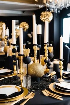 a black and gold table setting with white plates, silverware, candles and napkins