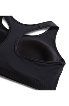 This moisture-wicking racerback sports bra offers a medium level of support that's ideal for your everyday workouts. Dri-FIT moisture-wicking technology Lined, with sewn-in soft cups 72% polyester, 28% spandex with 81% polyester, 19% spandex contrast Machine wash, line dry Imported Nylon Sports Bra With Go-dry Technology, Nylon Go-dry Sports Bra, Go-dry Nylon Sports Bra, Racerback Activewear With Built-in Padding For Light Sports, Supportive Racerback Activewear With Built-in Padding, Breathable Micro-elastic Sports Bra, Micro-elastic Moisture-wicking Sports Bra For Training, Moisture-wicking Micro-elastic Sports Bra For Training, Functional Breathable Micro-elastic Sports Bra