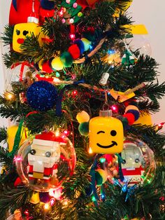 the christmas tree has been decorated with legos and other ornaments, including an ornament