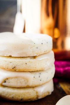 a stack of cookies with frosting on top