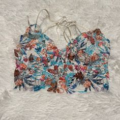 Lace Bralette By: Pink, Size: Small, Beautiful Floral Colors: Light Blue, Fascia, Orange, And Black On White. Nwt, With Removable Padding. Summer Beach Bra With Floral Print, White Cami Bra For Summer, White Strap Crop Top For Beach, White Summer Vacation Bra, Spring Floral Print Multicolor Bra, Blue Summer Bra For Vacation, Vacation Bra With Straps, Blue Summer Vacation Bra, Multicolor Beach Bra For Spring