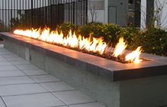 a fire pit is shown with flames coming out of it