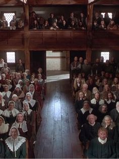 a large group of people sitting in chairs