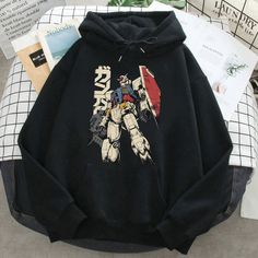 Unisex, Gundam Hoodie, 90s Anime Shirt, Vintage Shirt, Robot Anime Lovers, Anime Sweater, Japanese Manga Tshirt, Retro Gundam Anime Hoodie This unisex heavy blend hooded sweatshirt is relaxation itself. Made with a thick blend of cotton and polyester, it feels plush, soft and warm, a perfect choice for any cold day. In the front, the spacious kangaroo pocket adds daily practicality while the hood's drawstring is the same color as the base sweater for extra style points. .: 50% cotton, 50% polyes Casual Character Print Sweatshirt For Cosplay, Casual Graphic Print Hoodie For Cosplay, Casual Sweatshirt With Anime Print For Streetwear, Cosplay Graphic Print Crew Neck Hoodie, Graphic Print Hoodie For Cosplay With Crew Neck, Harajuku Style Hoodie With Anime Print And Crew Neck, Graphic Print Crew Neck Hoodie For Cosplay, Anime Print Hoodie For Cosplay With Crew Neck, Pop Culture Hoodie With Cartoon Print