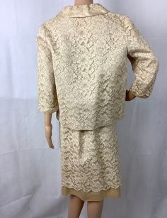 "No tags, possibly handmade Beautiful ivory/beige lace over satin jacket and skirt set is perfect for a wedding or vow renewal Measurements are approximate and taken laying flat, double where appropriate Skirt 13.5\" waist (27\" doubled) 19\" hips (38\" doubled 26\" length Jacket 19\" chest armpit to armpit 19\" waist 17\" sleeve length 23\" length center back collar to hem The snap is missing for the bow, see pictures and the loop for the hook at the collar could be tightened Small spot on righ Bridal Suit, Jacket And Skirt Set, Poet Shirt, Gloves Vintage, Vintage Mini Dresses, Womens Suits, Satin Jacket, Albany Ny, Lace Jacket