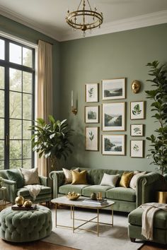 a living room filled with green couches and pictures on the wall above them in front of a large window