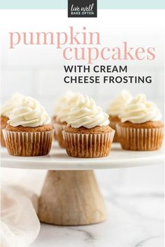 pumpkin cupcakes with cream frosting on a white cake platter and text overlay