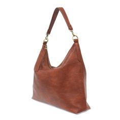 This oversized, slouchy, cool hobo bag is made of tumbled buffalo grain cinnamon-colored vegan leather, which gives it that casual boho chic look! With two included removable shoulder straps, you can wear it as a short shoulder bag or a crossbody bag. Dimensions: 13.5 in. H x 16 in. W x 3.5 in. D 2 Removable shoulder straps: Non-adjustable short shoulder strap drop: 10 in. Adjustable long shoulder strap: 21-25 in. 2 Interior open pockets Interior zip closure pocket Zippered Top Closure Exterior Versatile Cognac Hobo Bag For Everyday Use, Versatile Cognac Hobo Bag, Chic Brown Hobo Bag For Everyday, Bohemian Shoulder Bag For Everyday Fall Use, Everyday Bohemian Shoulder Bag For Fall, Bohemian Shoulder Bag For Everyday Fall, Brown Textured Leather Hobo Bag For Travel, Cognac Hobo Bag With Detachable Strap For Everyday Use, Cognac Soft Leather Hobo Bag For Everyday