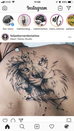 the back of a woman's stomach with tattoos on it and an image of a lion