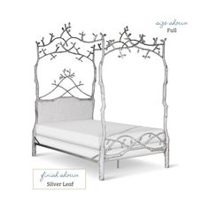 an iron bed frame with branches on the headboard and foot board, all in white