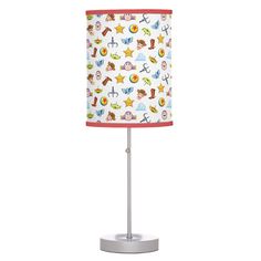 a lampshade with an animal pattern on it and a red light in the middle