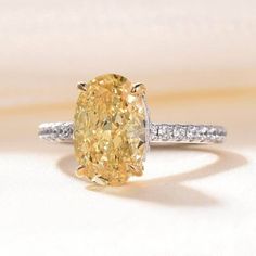 Indulge in the timeless beauty of our Classic 3.5 ct Yellow Sapphire Oval Cut Diamond Engagement Ring by Evani Naomi Jewelry. Made from 92.5% pure silver and 7.5% hypoallergenic metals then dipped 5x in 18k white gold, this stunning ring features a dazzling yellow sapphire in an oval cut. With its unique design and high-quality craftsmanship, this ring is the perfect choice for those seeking an affordable yet luxurious piece of jewelry. Don't miss out on this amazing addition to your collection. Black Skull Ring, Citrine Rings, Yellow Canary, Oval Cut Diamond Engagement Ring, Rings Oval, Cut Rings, Gothic Engagement Ring, Yellow Diamond Ring, Oval Cut Ring