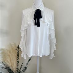 Zara White Ruffled Blouse Flowing Collared Shirt With Long Sleeves, Elastic Cuffs, And Ruffle Trim On The Front. Fastening With A Contrast Tied Bow And Button Up Fastening Hidden By A Placket. Siz: Small Material: 100% Polyester Condition: Nwt Party Blouse With Ruffles And Collar, Spring Office Wear Tops With Ruffles, Fitted Ruffle Sleeve Blouse For Office, Spring Formal Shirt With Ruffles, Spring Formal Shirt With Ruffled Collar, Formal Tops With Ruffles And Collar, Formal Shirt With Ruffled Collar For Spring, Formal Blouse With Ruffles And Collar, Formal Ruffled Collar Blouse