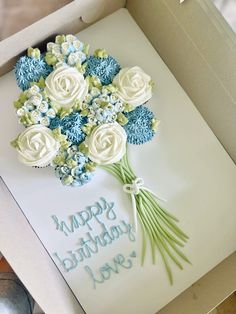 a birthday card in a box with flowers