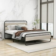 a modern bedroom with marble walls and flooring