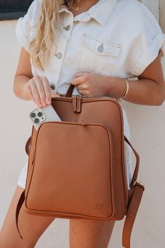 The Olivia Backpack is the most sleek and stylish backpack we've made! Conveniently made to store all the necessary things, including any 13" laptop. Plenty of pockets to hold and store all the essentials (phone, Chapstick, wallet, hand sanitizer, etc.). Use it for work, school, travel, and everything else in-between. There's a place for everything! This bag will quickly become one of your favorites. Bag Details: Made with Premium Vegan Leather Dims: 10"(H) X 14" (L) X 3.5" (W) Weight: 2 lbs. 1