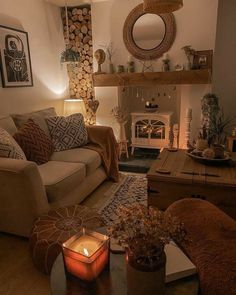 a living room filled with furniture and a fire place next to a mirror on the wall