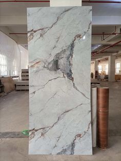 a large white marble slab in a warehouse