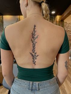 a woman with a tattoo on her back