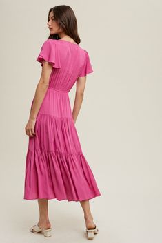 this magenta beauty from wishlist is the most flattering dress! it has feminine fluttery sleeves, a v-neckline, elastic waist and tiered skirt in a midi length. and it has pockets! the possibilities for where you can wear this lovely dress are nearly endless. it is dressy enough, especially with the right sandals to wear to a summer wedding or a bridal/baby shower. wear to a graduation party or on vacation. wear it on date night! you will find many occasions to wear this and turn all the heads! Chic Pink Dress With Elastic Waistband, Pink Flowy Rayon Midi Dress, Flowy Pink Rayon Midi Dress, V-neck Midi Dress With Ruffle Hem In Rayon, Rayon V-neck Midi Dress With Ruffle Hem, V-neck Rayon Midi Dress With Ruffle Hem, Rayon Midi Dress With Ruffle Hem And V-neck, Chic Pink Rayon Midi Dress, Pink Chic Maxi Dress With Flutter Sleeves