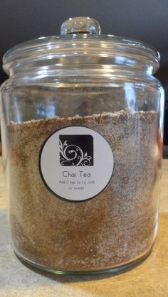 a jar filled with sand sitting on top of a counter