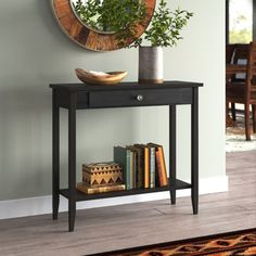 This classic and functional console table is the ideal accent piece for your living room, dining room, or entryway. Built from solid acacia wood, this table showcases a finish that highlights the wood's natural grain. Its airy silhouette rests on sleek, tapered legs for a modern silhouette. A single drawer opens to reveal room for gloves, pet leashes, and mail, The open shelf gives you even more room to display decor, a set of baskets, or for organizing out-the-door essentials. Plus, this table Small Entryway Table, Console Table Wood, Bathroom Artwork, Hallway Table, Small Entryway, Pet Leashes, Wood Console Table, Table Wood, Wood Console