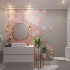 a modern bathroom with pink hexagonal tiles on the wall