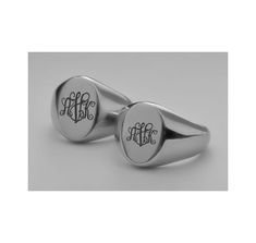 Our personalized signet ring set can be custom engraved for your engagement, as promise rings or wedding bands. A personalized ring is a sentiment of love that can be inscribed with names, dates or any custom message. If you would like a logo, enter the number in parentheses in the text for engraving. This silver signet ring set has a comfort fit and is made from the highest quality stainless steel that will never rust, change color or fade. Our rings are customized with precision laser engraving that is clear and bold, and most importantly, will last a lifetime.  Personalized Signet Ring Set Finish: High Polish Stainless Steel Sizes available: 5-6-7-8-9-10-11-12-13-14-15 IMPORTANT: **A restocking fee for replacement rings will be charged if an incorrect ring size is ordered and does not f Classic Oval Couple Rings For Anniversary, Classic Personalized Ring Jewelry, Personalized Classic Ring Jewelry, Classic Stainless Steel Signet Ring For Formal Occasions, Personalized Classic Ring, Classic Adjustable Couple Rings, Classic Personalized Jewelry For Promise Ring, Adjustable Initial Ring With Polished Finish For Wedding, Formal White Gold Jewelry With Engraving Option