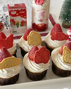 some cupcakes with frosting and decorations on them